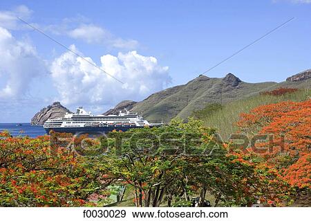 Stock Photo - French Polynesia, Marquesas archipelago, Nuku Hiva island, cruise ship anchored in the Taihoae bay. Fotosearch