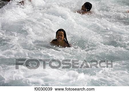 French Polynesia, Marquesas archipelago, Ua Pou island, village of Hakahau, children playing in the sea View Large Photo Image Stock Photo - French Polynesia, Marquesas archipelago, Ua Pou island, village of Hakahau, children playing in the sea. Fotosearch