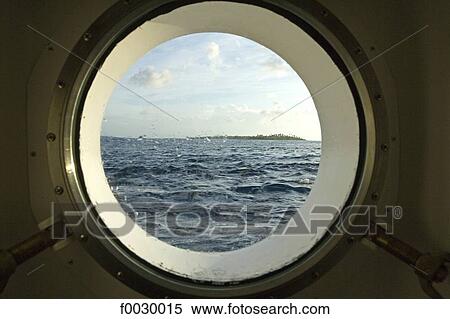 French Polynesia, Tuamotus, Fakarava atoll seen through a porthole of the ship Aranui View Large Photo Image Stock Photography - French Polynesia, Tuamotus, Fakarava atoll seen through a porthole of the ship Aranui. Fotosearch