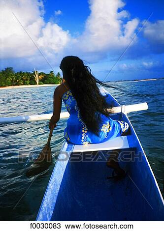 French Polynesia, Tuamotus, Rangiroa, woman paddling on an outrigger View Large Photo Image Stock Image - French Polynesia, Tuamotus, Rangiroa, woman paddling on an outrigger. Fotosearch