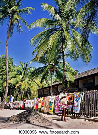 Stock Photograph - Granada, Grand anse beach, T-shirts on sale on the beach. Fotosearch