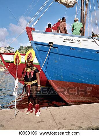 Granada, Saint George's, disguised woman by a local boat during carnival View Large Photo Image Stock Photograph - Granada, Saint George's, disguised woman by a local boat during carnival. Fotosearch
