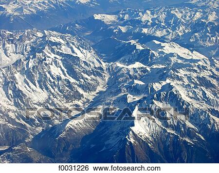 Italy, Alps, snowy mountains, aerial view View Large Photo Image Stock Photograph - Italy, Alps, snowy mountains, aerial view. Fotosearch
