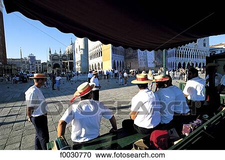 Stock Image - Italy, Venice, Saint Mark's square, gondoliers . Fotosearch
