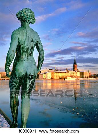 Sweden, Stockholm, Gamla Stan: old city, Riddarholmen island view from the city hall in winter, statue at fore View Large Photo Image Stock Image - Sweden, Stockholm, Gamla Stan: old city, Riddarholmen island view from the city hall in winter, statue at fore. Fotosearch