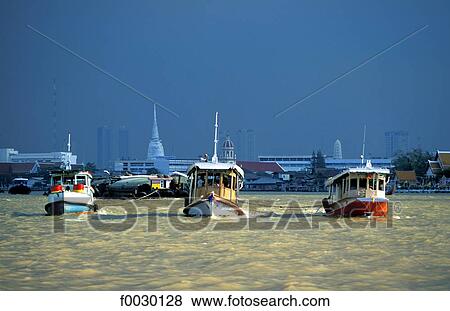 Stock Photo - Thailand, Bangkok, Chao Praya river, tugboats tracting barges. Fotosearch