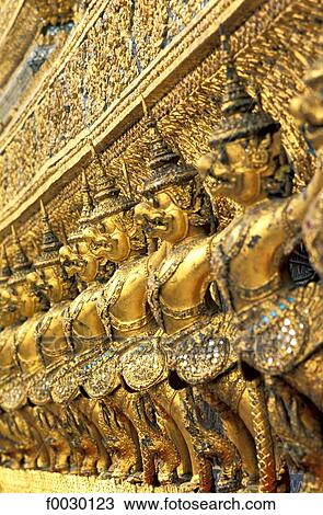 Thailand, Bangkok, emerald Buddha temple "Wat Phra Keo", row of statues on a facade of the royal chapel View Large Photo Image Stock Image - Thailand, Bangkok, emerald Buddha temple "Wat Phra Keo", row of statues on a facade of the royal chapel. Fotosearch
