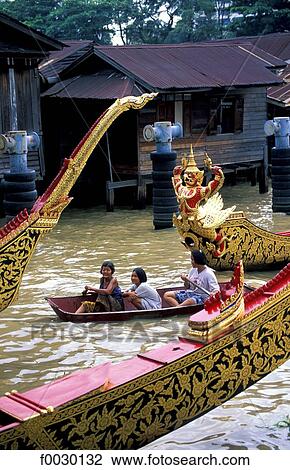 Stock Image - Thailand, Bangkok, royal barges on the Chao Praya River. Fotosearch
