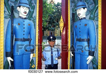 Thailand, Bangkok, Wat Rajobopit Buddist temple, warden opening the carved gates View Large Photo Image Stock Photo - Thailand, Bangkok, Wat Rajobopit Buddist temple, warden opening the carved gates. Fotosearch