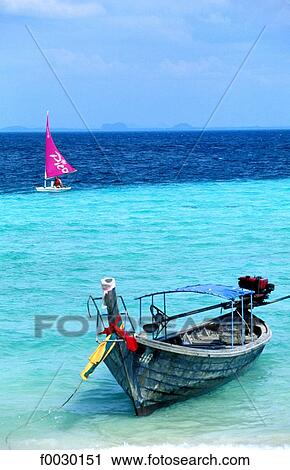 Thailand, Koh Phi Phi, windsurf and long tail outrigger View Large Photo Image Stock Image - Thailand, Koh Phi Phi, windsurf and long tail outrigger. Fotosearch