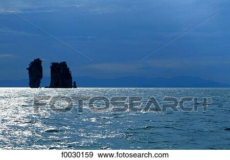 Stock Photo - Thailand, Phang Nga bay, rocky islets at backlighting. Fotosearch