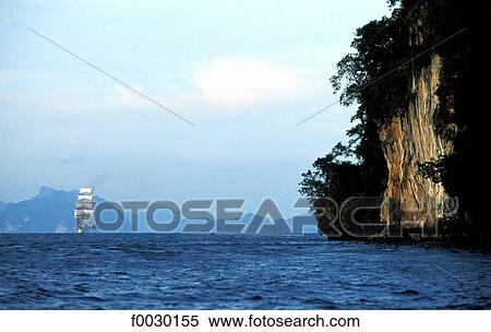 Thailand, Phuket island, Phang Nga bay, cruise boat under sails View Large Photo Image Stock Photography - Thailand, Phuket island, Phang Nga bay, cruise boat under sails. Fotosearch