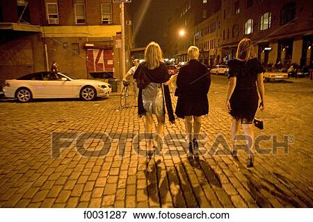United States, New York, Manhattan, street scene at night, three women View Large Photo Image Stock Photo - United States, New York, Manhattan, street scene at night, three women. Fotosearch
