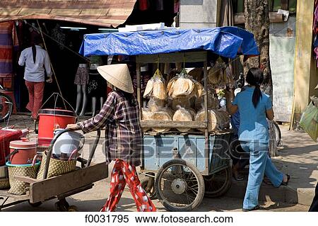 Vietnam, Hoi An, itinerant seller. View Large Photo Image Stock Photography - Vietnam, Hoi An, itinerant seller.. Fotosearch