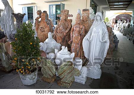 Stock Image - Vietnam, Hoi An, pottery stall and statues.. Fotosearch