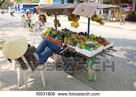 Stock Photograph - Vietnam, Hoi An, vegetables and fruits for sale.. Fotosearch