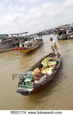 Picture - Vietnam, Mekong delta, small boat carrying vegetables.. Fotosearch