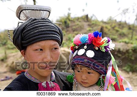 Stock Photo - Vietnam, road to Sappa, Hmong woman and her child.. Fotosearch
