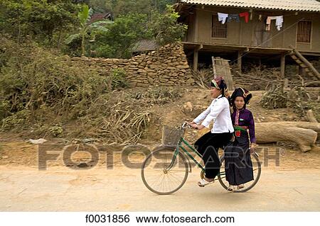 Vietnam, Son La, women on bicycles. View Large Photo Image Stock Photograph - Vietnam, Son La, women on bicycles.. Fotosearch