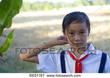 Vietnam, village by Mang Thit river, portrait of a young girl. View Large Photo Image Stock Photo - Vietnam, village by Mang Thit river, portrait of a young girl.. Fotosearch