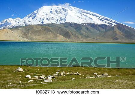 Stock Image - China, Xinjiang, lake Karakul and Muztagh Ata. Fotosearch