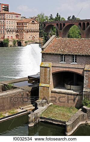 Picture - France, Languedoc, Albi, bank of the Tarn river, windmill. Fotosearch