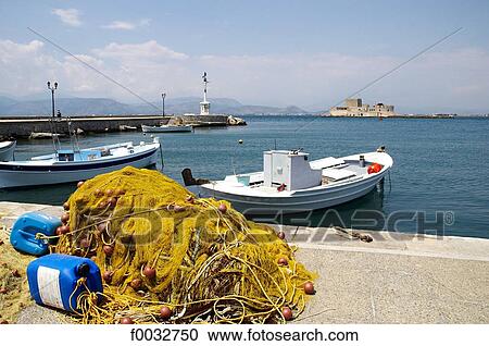 Greece, Peloponnese, Nafplion, the port and Bourtzi castle in the background View Large Photo Image Stock Image - Greece, Peloponnese, Nafplion, the port and Bourtzi castle in the background. Fotosearch