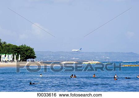 Stock Photograph - Indonesia, Bali, beach of Kuta, plane landing. Fotosearch