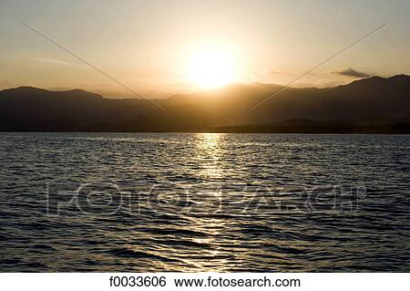 Stock Photograph - Indonesia, Bali, Candidasa, sunset. Fotosearch