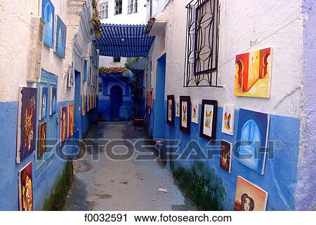 Stock Image - Morocco, Chefchaouen, medina, exhibition of paintings. Fotosearch