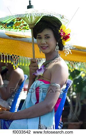 Thailand, berween Udon Thani and Nong Khai, woman with a sunshade View Large Photo Image Stock Image - Thailand, berween Udon Thani and Nong Khai, woman with a sunshade. Fotosearch