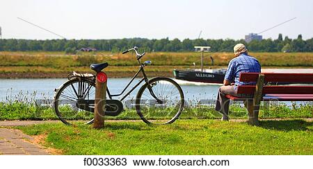 Stock Image - The Netherlands, dutchman on a bench. Fotosearch