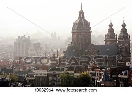 Picture - The Netherlands, North Holland, Amsterdam, roofs and bell tower. Fotosearch