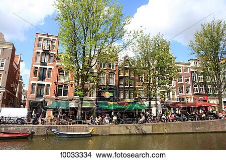 The Netherlands, North Holland, Amsterdam, restaurant along the canal View Large Photo Image Picture - The Netherlands, North Holland, Amsterdam, restaurant along the canal. Fotosearch