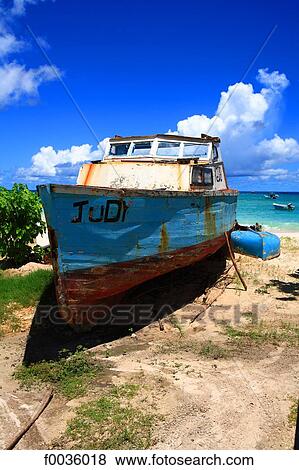 Stock Photo - Barbados, Oistins, boat on the beach. Fotosearch