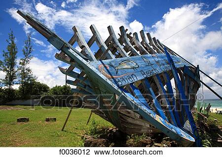Stock Image - Barbados, Silver Sands, boats under construction. Fotosearch