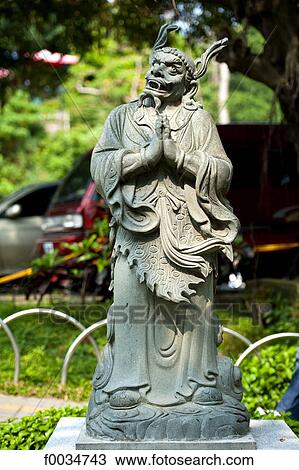 Stock Image - China, Taiwan, Changhua, buddhist temple, statue. Fotosearch