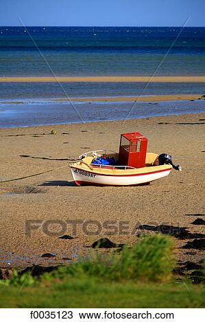 Stock Image - France, Brittany, La Trinite sur Mer, boat on the beach. Fotosearch