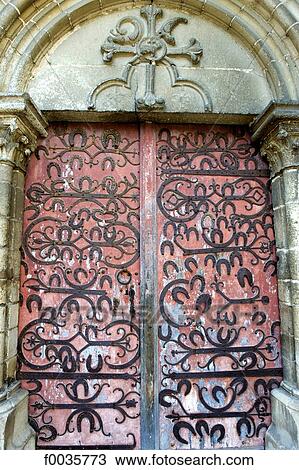 Stock Image - France, Burgundy, door of the church, horseshoe. Fotosearch