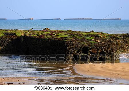 Stock Photography - France, Normandy, Arromanches, artificial harbour. Fotosearch