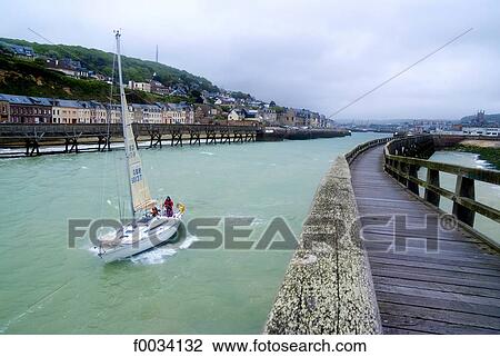 Stock Image - France, Normandy, Fecamp, boat leaving the harbour. Fotosearch