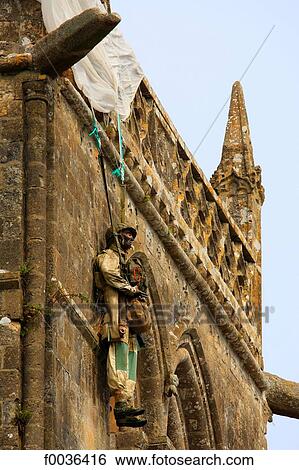 Stock Photograph - France, Normandy, Sainte Mere Eglise, church and his mannequin. Fotosearch