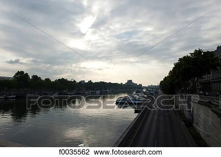 Stock Image - France, Paris (75), Ile de France, bank of the Seine by night. Fotosearch