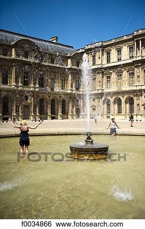Stock Photograph - France, Paris, Louvre, fountain. Fotosearch