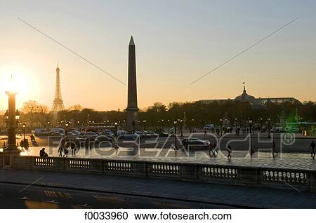 Stock Image - France, Paris, obelisk and Eiffel tower, sunset. Fotosearch