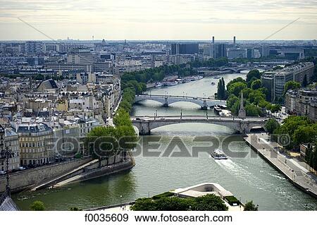 Stock Photo - France, Paris, pont de la tournelle and pont de l'archeveche. Fotosearch