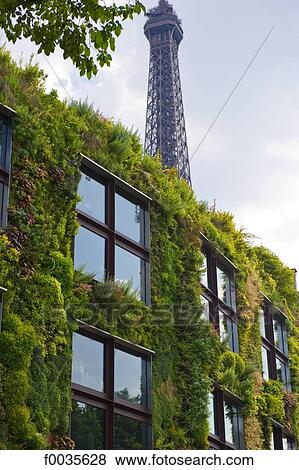 Stock Photo - France, Paris, quai Branly museum and Eiffel tower. Fotosearch