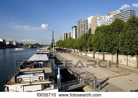 France, Paris, quai de Grenelle and the Eiffel tower in the background View Large Photo Image Stock Image - France, Paris, quai de Grenelle and the Eiffel tower in the background. Fotosearch