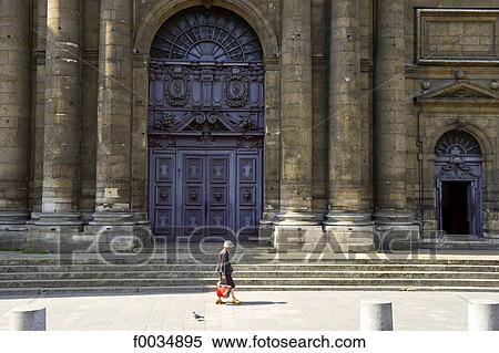 Stock Photography - France, Paris, Saint Paul's church, old woman. Fotosearch
