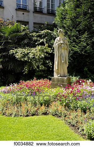 Stock Image - France, Paris, statue of Voltaire. Fotosearch